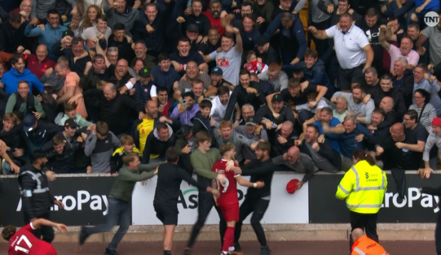 Liverpool jumped over the barriers around the Molineux pitch to embrace the travelling Liverpool fansCredit: TNT SPORT